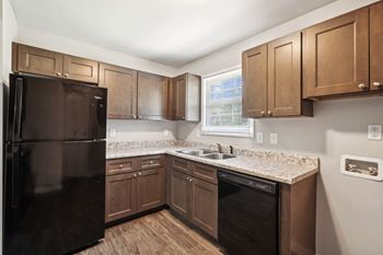 Kitchen with brown cabinets